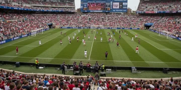 College soccer team competing in a stadium, aiming for NCAA Tournament selection.