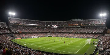 2025 MLS Playoffs: Top 3 Defining Semifinal Moments Dynamic shot of an MLS playoff game with players in action and a cheering crowd under bright stadium lights.