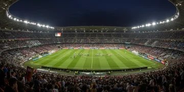 Packed stadium in Italy with fans cheering, symbolizing Serie A comeback and resurgence.